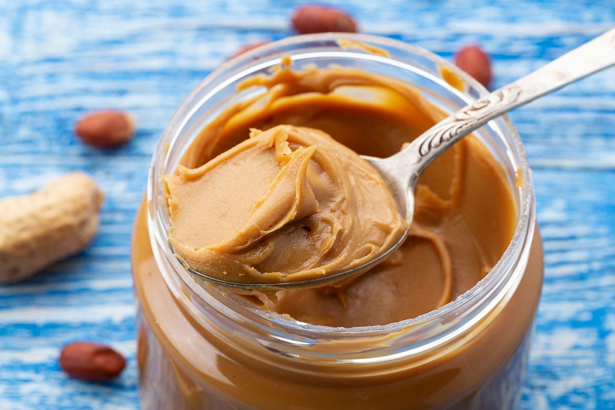 Peanut butter in an open jar (Getty Images/Sanny11)